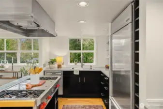 Everything is at your fingertips with open cabinetry and large pull-out drawers in the kitchen.