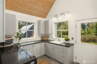 The spacious laundry room and adjacent pantry is a dream. Room for everything and everything in its place. The covered entry at west side of home offers  easy access from the garage after that Costco run!