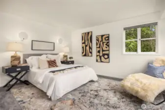 The spacious primary bedroom, located on the main floor.