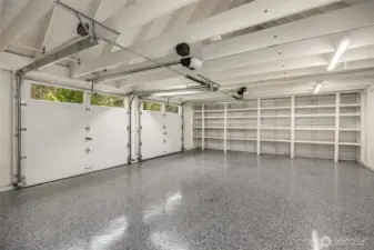 This fabulous garage, offers new EV Charging  built-in storage and beautiful epoxy flooring. The 2-garage door openers are new.