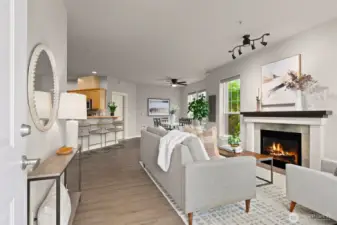 This open floor plan lives large, flowing seamlessly between living room, dining room, and kitchen