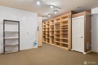 Fabulous built in shelving and extra storage closet in garage