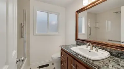 Main floor bathroom with shower and tub