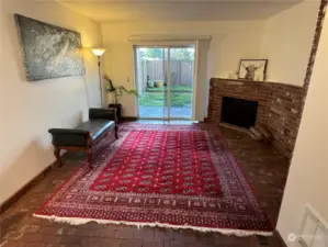 Living room warmed with a cozy fireplace