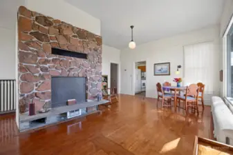 Looking from the entry toward the dining room with the kitchen beyond.