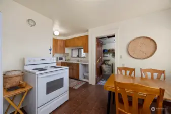 Looking at the kitchen with the "back porch" beyond.