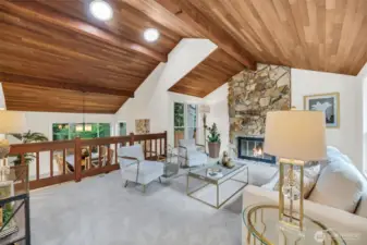 Spacious living room with vaulted ceiling is open to the formal dining room. Perfect for entertaining