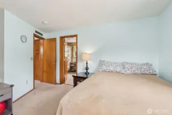 Generously sized primary suite w/ direct access to the en suite bath—your private retreat for rest & relaxation.
