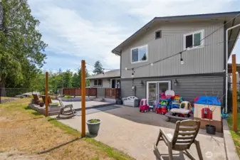 Fully fenced patio area w/ multiple deck levels—perfect for privacy, entertaining, & enjoying outdoor living from every angle.
