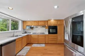 Sleek kitchen view highlighting the high-end LG fridge w/ InstaView window—modern style meets everyday convenience.