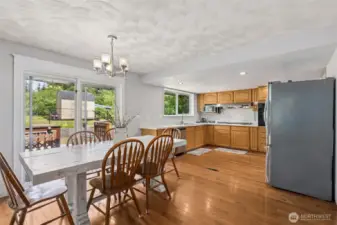 Dining area offers a warm connection to the kitchen—perfect for casual meals or hosting guests with ease.vvv