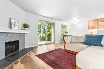 Cozy wood burning fireplace and nice natural light.