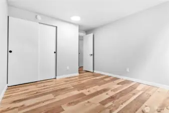 Bedroom 2 with beautiful flooring throughout!