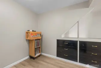 View of bedroom#2 on lower level with built-in drawers/storage.