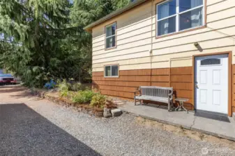 Basement entrance that leads to rec room. Gated driveway leads to back yard.