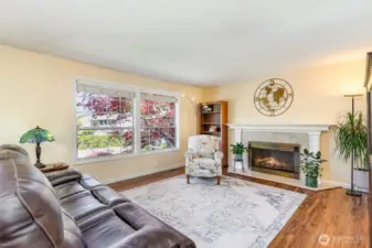 Upstairs main living space with cozy fireplace.