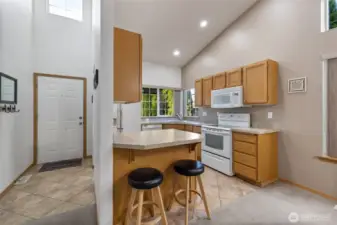 Natural light pours into the entry as you access the convenient kitchen.