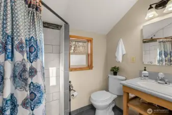 Primary ¾ Bath -  Updated ¾ bath off the primary suite features a tiled shower, modern finishes, and natural light—adding comfort and convenience to this private retreat.