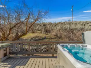 Private Hot Tub Patio -  Unwind in your private hot tub just steps from the primary suite—perfect for soaking under the stars and enjoying the peaceful foothills of Lake Chelan year-round.