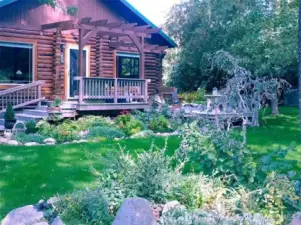 Please note: The current photos were taken in winter. During spring and summer the yard comes alive with lush grass and abundant perennials, creating a beautiful garden setting.