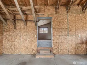 Detached Shop – Interior  Spacious shop interior shown empty to highlight the full usable space—ideal for projects, equipment storage, or creative workspace.