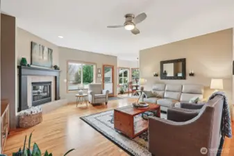 Spacious living room with large windows and fireplace