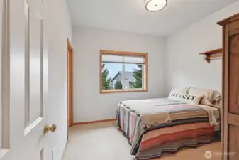 Versatile bedroom space with walk-in closet.