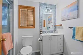 Lower level updated bath with a walk in shower