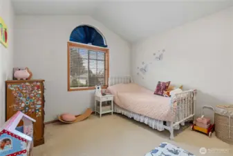 3rd bedroom with lovely window. Tall ceilings are featured