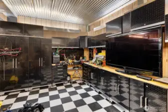 All diamond plate cabinetry & storage, and workbenches stay with the home!