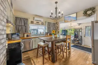 Another view of the kitchen. The mud room can be seen to the right. Notice the mini-split for added comfort.