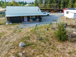 35'x42' Outbuilding currently houses a 37 ft long 5th wheel trailer that will be removed prior to closing.