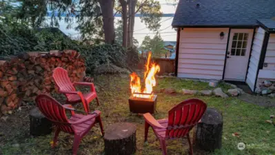 Enjoy the sunsets from the backyard around a campfire.  A pea gravel sitting area has since been added (in the next photo).