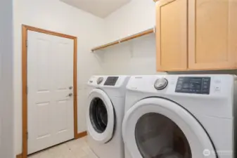 Laundry room with door to garage