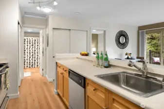 New luxury plank flooring flows through the kitchen, hallway & bath.