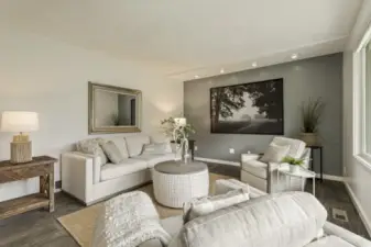 Refined living area highlighted by custom beadboard and tasteful lighting selections.