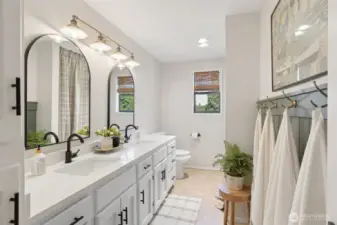 Upstairs shared bath blends sleek modern style w/ a double vanity, upgraded finishes & plenty of counter space—perfect for busy mornings or relaxed evening routines