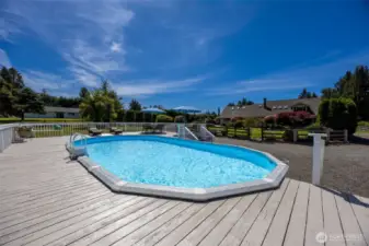 Resort-style pool & spacious deck offer a perfect setting for summer fun, entertaining, or unwinding poolside—designed for relaxation with plenty of room to gather & enjoy the outdoors
