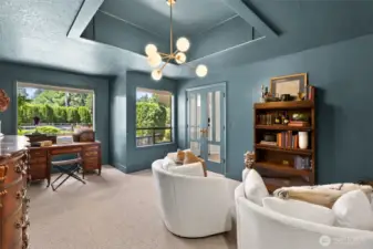 Versatile 5th bedroom on the main level doubles as a stunning office—featuring elegant French doors, expansive windows, & abundant natural light. The perfect blend of function & style.