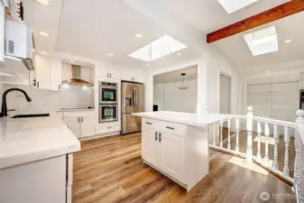 Bright kitchen with skylight and quartz countertops