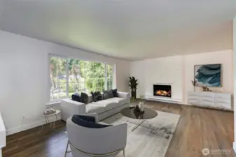Living room with fireplace and refinished hardwood floors