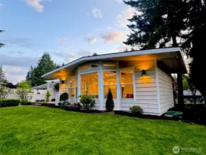 Landscaped and level backyard in the evening