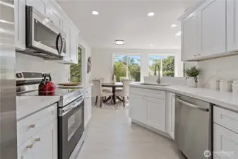 Modern, stylish kitchen featuring all-new stainless steel appliances