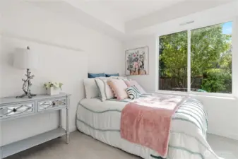 Bright lower-level bedroom with natural light