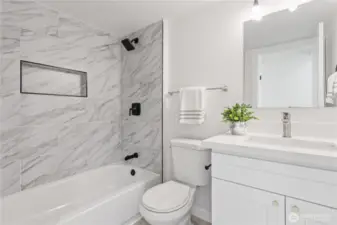 onvenient full bathroom on the lower level with modern finishes