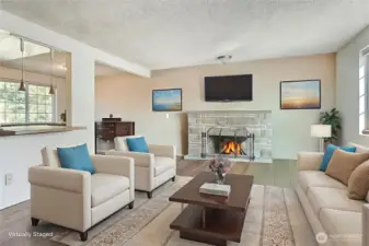 Spacious living room that is open to kitchen and dining area including a pricture window with peakaboo view. Room is virtually staged, does not reflect owners personal items.