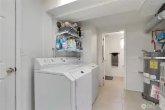 Laundry/Utility area leads to the one car garage with storage.