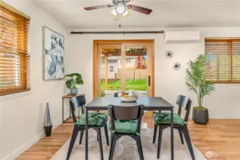 Big open dining area just off the kitchen looks out to huge fenced bak yard