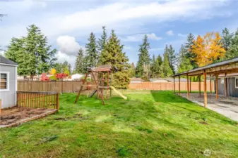 Fenced back yard has so much room for gardening