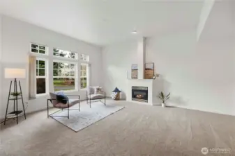 Spacious open concept living with high ceilings and lots of natural light